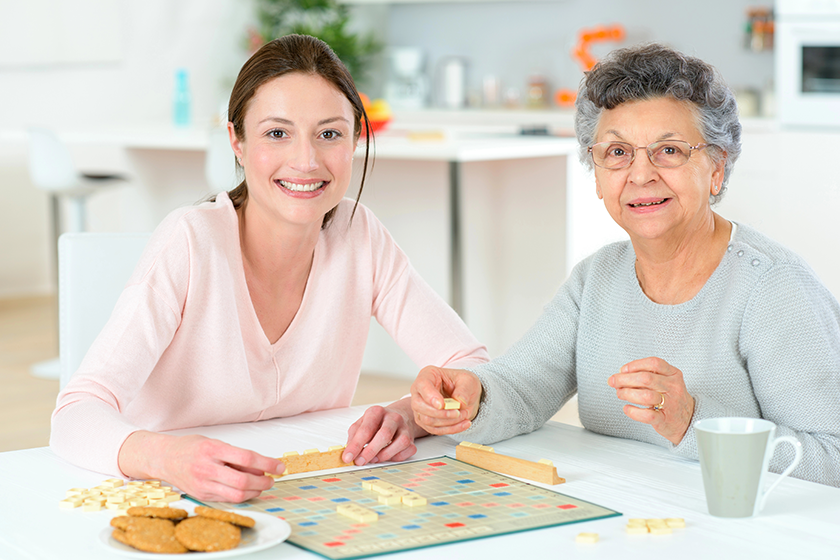 elderly-woman-playing-a-board-game