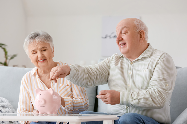 senior-couple-piggy-bank-home