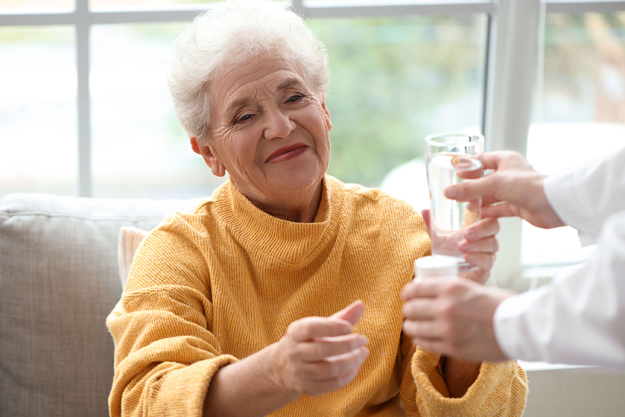 senior-woman-taking-pills-glass-water-doctor-home senior-woman-taking-pills-glass-water-doctor-home