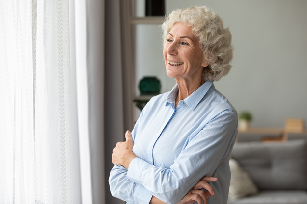 smiling-elderly-woman-look-in-distance-feeling-happy