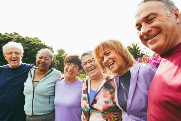 Multiracial,Senior,People,Having,Fun,Hugging,Each,Other,After,Sport