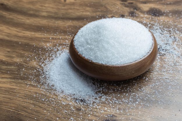 White Sugar in wooden floor.