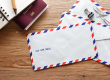 Air mail envelope on the wood table