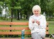 Senior woman using smartphone while sitting