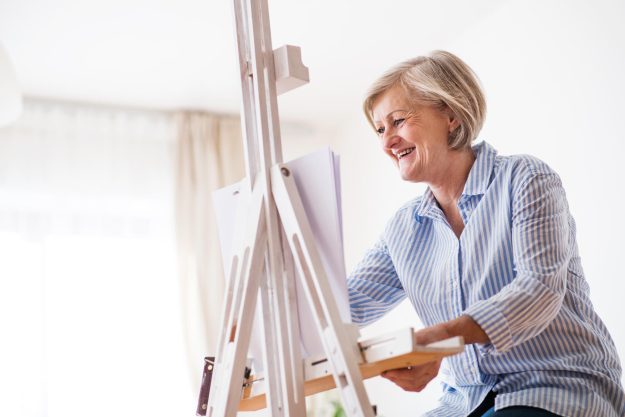 A,Senior,Woman,Painting,At,Home.