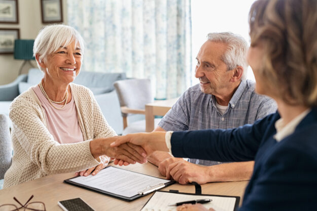 Happy,Old,Woman,Shaking,Hands,With,Medical,Adviser,For,Health