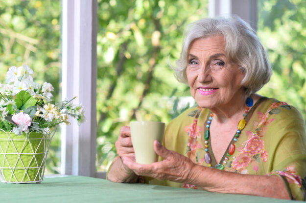 Portrait of a beautiful woman in the park in summer